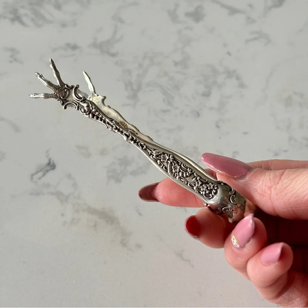 Antique sterling sugar tongs made by Whiting Manufacturing Co